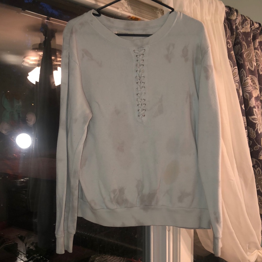 Cream sweatshirt with blush colored blotches.